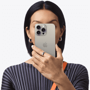 Person holding iPhone 15 Pro Max in front of their face